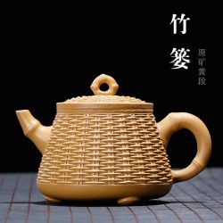 Tetera de Arcilla Púrpura de Yixing Tejida a Mano en Cesta de Bambú